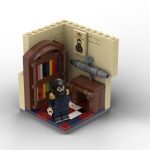 Recreación en bloques de construcción del despacho de Isaac Peral en Cartagena, incluyendo minifigura del inventor, escritorio con maqueta del submarino y librería clásica.