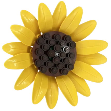 Girasol de LEGO con pétalos amarillos y centro marrón sobre fondo transparente.