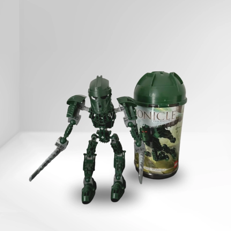 Figura LEGO Bionicle verde con arma y caja original.